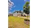 Two-story home featuring a well-manicured lawn, two-car garage and a driveway at 520 Harmony Way, Locust Grove, GA 30248