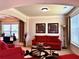 Bright and airy living room featuring elegant furnishings and large windows at 520 Harmony Way, Locust Grove, GA 30248