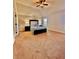 Spacious main bedroom with neutral walls, ceiling fan, and a comfortable queen-sized bed at 520 Harmony Way, Locust Grove, GA 30248