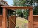Gated entrance to a green backyard leading down to a fire pit at 722 Beauregard Sw Dr, Marietta, GA 30064