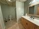 Bathroom with a shower, toilet, sink, and patterned ceiling at 722 Beauregard Sw Dr, Marietta, GA 30064