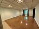 Large bonus room with natural light, hardwood floors, and plenty of open space for recreation or entertainment at 722 Beauregard Sw Dr, Marietta, GA 30064