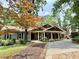 Charming home featuring a covered front porch, stone accents, and a well-maintained yard at 722 Beauregard Sw Dr, Marietta, GA 30064