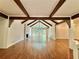 Bright living room with hardwood floors, stone fireplace, vaulted ceilings, and natural light at 722 Beauregard Sw Dr, Marietta, GA 30064