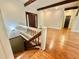 Staircase with hardwood steps leading to a landing, and an open view of the home interior at 722 Beauregard Sw Dr, Marietta, GA 30064