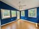 Bright sunroom featuring wood-look floors, many windows, and access to a private deck at 722 Beauregard Sw Dr, Marietta, GA 30064