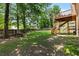 Large backyard with grass area, wooden fence, picnic table and elevated deck at 920 Highfield Ct, Lawrenceville, GA 30043