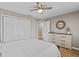 Cozy bedroom boasts natural light, a ceiling fan, hardwood floors, and ample closet space at 920 Highfield Ct, Lawrenceville, GA 30043