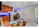 Bonus room with kitchen features, stylish track lighting, and a separate workstation for added convenience at 920 Highfield Ct, Lawrenceville, GA 30043