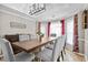 Elegant dining room with bright windows and statement curtains at 920 Highfield Ct, Lawrenceville, GA 30043