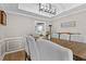 Formal dining room featuring a large wooden table and chairs beneath a modern chandelier at 920 Highfield Ct, Lawrenceville, GA 30043