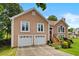 Charming two-story home with a well-manicured lawn and a two-car garage at 920 Highfield Ct, Lawrenceville, GA 30043