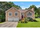 Charming two-story home with a well-manicured lawn and a two-car garage at 920 Highfield Ct, Lawrenceville, GA 30043