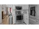Close up of kitchen featuring stainless steel appliances and modern white cabinets at 920 Highfield Ct, Lawrenceville, GA 30043