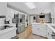 Modern kitchen with stainless steel appliances, white cabinets, and a breakfast bar at 920 Highfield Ct, Lawrenceville, GA 30043