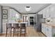 Bright kitchen with white cabinetry, stainless steel appliances, and an adjoining dining area at 920 Highfield Ct, Lawrenceville, GA 30043