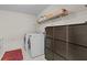 Bright laundry room with modern appliances and built-in cabinet, offering functionality and storage space at 920 Highfield Ct, Lawrenceville, GA 30043