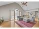 Spacious living room with high ceilings, hardwood floors, and a cozy gray sofa at 920 Highfield Ct, Lawrenceville, GA 30043