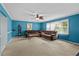 Spacious living room with large windows, carpet flooring, and comfortable seating, great for relaxing and entertaining at 920 Highfield Ct, Lawrenceville, GA 30043
