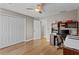 Home office with hardwood floors, a ceiling fan, and ample storage, perfect for a functional workspace at 920 Highfield Ct, Lawrenceville, GA 30043