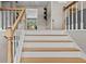 Elegant staircase with wooden handrails and white risers leading to the upper level at 920 Highfield Ct, Lawrenceville, GA 30043