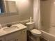 Bright bathroom features a tile shower-tub combo, toilet, and a vanity with a sink at 1130 Weatherstone Ne Dr, Atlanta, GA 30324