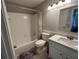 Bathroom with shower-tub, vanity with sink, and toilet with wood-look flooring at 1130 Weatherstone Ne Dr, Atlanta, GA 30324