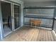 Open-air deck, accessible from the dining room, with wood flooring and a decorative privacy screen at 1130 Weatherstone Ne Dr, Atlanta, GA 30324