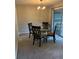 The dining room features a glass table with a set of four matching chairs at 1130 Weatherstone Ne Dr, Atlanta, GA 30324