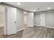 Finished basement features an open layout and modern flooring at 1406 Kennesaw Nw Dr, Atlanta, GA 30318