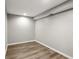 Unfinished basement featuring wood-look vinyl flooring, recessed lighting and light-grey walls at 1406 Kennesaw Nw Dr, Atlanta, GA 30318