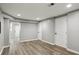 Unfinished basement featuring wood-look vinyl flooring and recessed lighting at 1406 Kennesaw Nw Dr, Atlanta, GA 30318