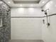 Modern bathroom features a tiled standup shower with dual shower heads and patterned accent tiles at 1406 Kennesaw Nw Dr, Atlanta, GA 30318