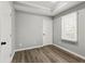 Bedroom with modern flooring, large window, and ample natural light at 1406 Kennesaw Nw Dr, Atlanta, GA 30318