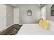 Comfortable bedroom features a large bed, hardwood floors, natural light from windows, and modern decor at 1406 Kennesaw Nw Dr, Atlanta, GA 30318