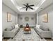Living room featuring a neutral color scheme, plush couches, and decorative wall art at 1406 Kennesaw Nw Dr, Atlanta, GA 30318