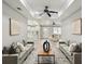 Living room with neutral walls, grey sofas, and decorative wall art and interior design at 1406 Kennesaw Nw Dr, Atlanta, GA 30318