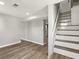 Spacious living room with modern flooring and staircase at 1406 Kennesaw Nw Dr, Atlanta, GA 30318