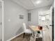 Bright office space features a minimalist desk, chair, and view of the kitchen at 1406 Kennesaw Nw Dr, Atlanta, GA 30318