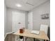 Bright office space features an open book on a desk, hardwood floors, and neutral colors at 1406 Kennesaw Nw Dr, Atlanta, GA 30318