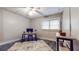 This basement area contains a desk, a dark-painted floor, and ample room for activities at 147 Olympic Pl, Decatur, GA 30030