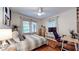 Comfortable bedroom space with hardwood floors and large windows at 147 Olympic Pl, Decatur, GA 30030