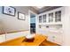 Bright dining area featuring hardwood floors, built-in cabinets, and decorative lighting at 147 Olympic Pl, Decatur, GA 30030