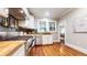 Modern kitchen with hardwood floors, stainless steel appliances, and butcher block countertops at 147 Olympic Pl, Decatur, GA 30030