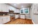 Well-appointed kitchen features stainless steel appliances, light cabinets, and ample counter space at 147 Olympic Pl, Decatur, GA 30030