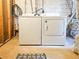 View of the laundry area with a white washer and dryer setup, showcasing the home's practical amenities at 147 Olympic Pl, Decatur, GA 30030