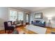 Bright living room with hardwood floors, fireplace, built-in cabinets, and neutral decor at 147 Olympic Pl, Decatur, GA 30030