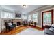 Cozy living room featuring a fireplace, hardwood floors, and stylish decor at 147 Olympic Pl, Decatur, GA 30030