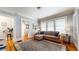 Inviting living room featuring hardwood floors, neutral paint, and a large area rug at 147 Olympic Pl, Decatur, GA 30030