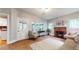 Inviting living room space with fireplace and views of the backyard at 147 Olympic Pl, Decatur, GA 30030